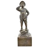 AFTER HANS KECK; an early 20th century patinated bronze figure, Alpine boy standing on a rock,