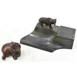 A late 19th/early 20th century spelter desk stand modelled with a stalking bear beside a hinged