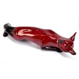 CHARLES NOKE FOR ROYAL DOULTON; a model of a flambé fox, length 31cm.Additional InformationGeneral