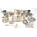 A collection of assorted silver plate and metalware to include a Victorian teapot with chased