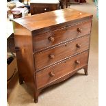 An early 19th century mahogany and crossbanded three drawer chest with further inlaid detail, on