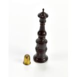 A 19th century treen needle and thimble holder of baluster form raised on circular base, height