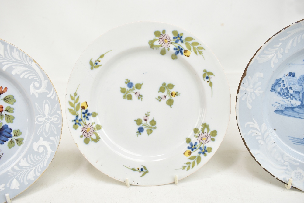 Three 18th century Bristol Delft plates, two with floral decoration and one with chinoiserie-type - Image 3 of 5