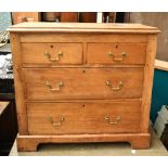A late 19th century pine chest of two short over two long drawers, raised on bracket feet, height