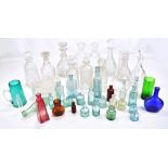 A collection of assorted glassware to include Murano clowns, various decanters to include cut