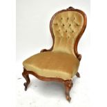 A Victorian walnut framed spoon back nursing chair (af). Additional InformationNumerous splits and