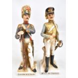A pair porcelain figures modelled as Napoleonic soldiers inscribed to bases respectively 'Officier