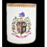 An early 20th century hand painted porcelain tankard with armorial crest to the centre flanked by