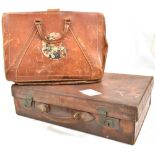 A vintage leather suitcase, length 56cm, together with a Ceyenet stationary bag (2).Additional
