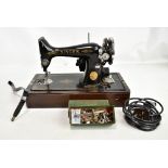 SINGER; a cased sewing machine.