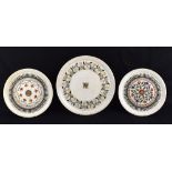Three alabaster plates with pietra dura floral decoration, diameter of largest example 34cm (3).