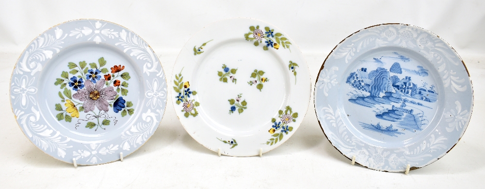 Three 18th century Bristol Delft plates, two with floral decoration and one with chinoiserie-type