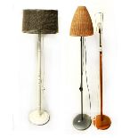 Three various standard lamps to include a mid-20th century turned wooden example,