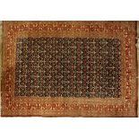 A modern Middle Eastern red ground rug, 257 x 157cm.