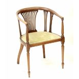 An Edwardian mahogany inlaid tub chair with slatted back splats and sides, with upholstered seats.