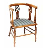 An Edwardian mahogany inlaid tub chair with slatted back slates and side,