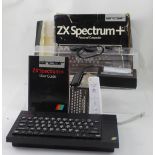 A boxed ZX Spectrum+ personal computer, a quantity of games,