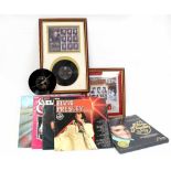 A quantity of Elvis Presley memorabilia to include a wall clock mounted on an Elvis 'Devil in