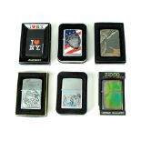 A collection of sixteen boxed and loose Zippo lighters to include New York Police, Harrison Line,