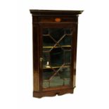 A 19th century mahogany glazed wall-hanging cupboard of small proportions,