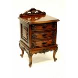 A 19th century style mahogany bow-fronted bedside cupboard with three drawers,