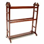 An Edwardian mahogany towel rail on square supports, width 80cm, height 90cm.