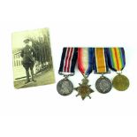 A WWI group of four medals, WWI trio awarded to lieutenant W Hall,