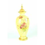 A Royal Worcester blush ware twin-handled vase with lobed body, painted with flowers,