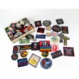 A large quantity of mixed Rock and Pop cloth and metal badges to include Black Sabbath, Status Quo,