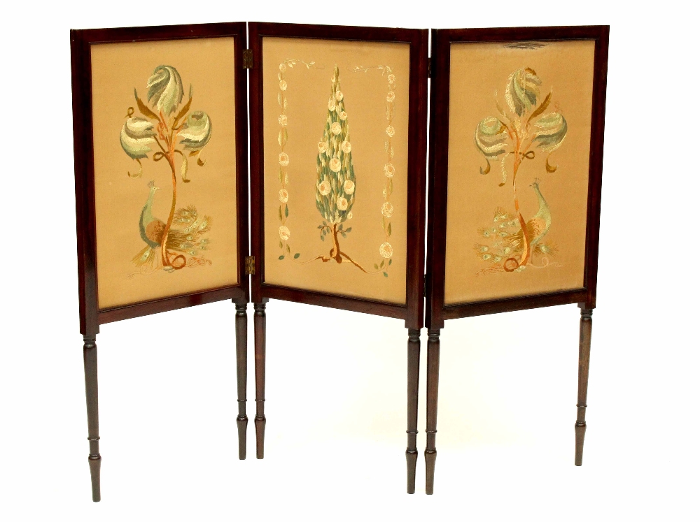 An Edwardian rosewood three-fold screen inlaid with needlework panels depicting flora and fauna,