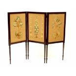 An Edwardian rosewood three-fold screen inlaid with needlework panels depicting flora and fauna,
