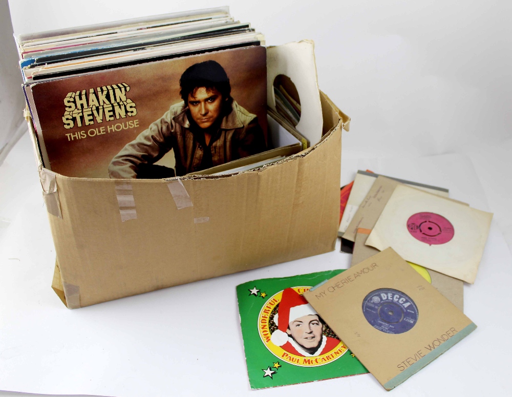 A quantity of vinyl albums and singles to include Shakin' Stevens, ABBA and Paul McCartney.
