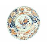 A Japanese Imari shallow dish decorated with chrysanthemums, prunus and birds and gilt-heightened,