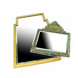 A satinwood inlaid shaped wall mirror with bevelled plate and a brass-framed mirror with embossed