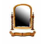 A Victorian mahogany swivel toilet mirror with spiral twist side supports on shaped marble base