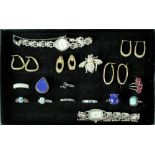 A quantity of costume jewellery to include fashion watches, hardstone rings,