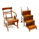 A Regency-style mahogany metamorphic library chair with cane seat,