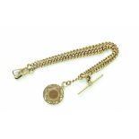 A 9ct gold double Albert watch chain with medallion fob, swivel and T-bar clasps,