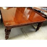 A Victorian mahogany wind-out D-end dining table with one extra leaf,