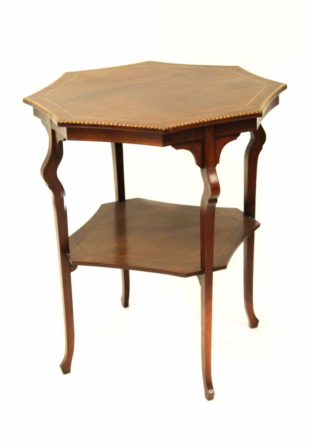 An Edwardian mahogany inlaid occasional table with shaped top above four square tapering legs