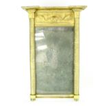 A small Continental-style pier glass with stepped pediment above frieze embossed with foliate