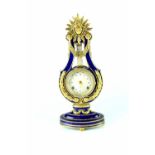 A Franklin Mint Marie-Antoinette chiming mantel clock, height 39cm.