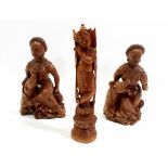 Two late 19th century carved Chinese hardwood figures of the same lady and dog,