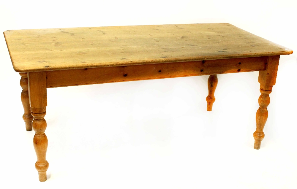 A modern pine rectangular farmhouse-style kitchen table, raised on turned supports, length 184cm.