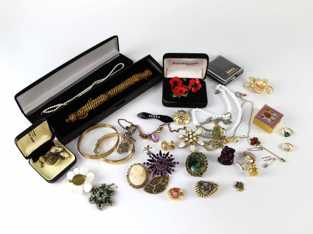 A small quantity of costume jewellery to include a cameo brooch, bangles, etc.