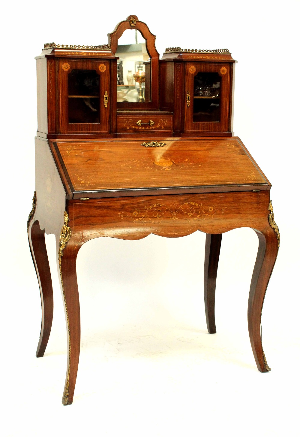 A 19th century rosewood bonheur du jour with inlaid Classical decoration,