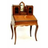 A 19th century rosewood bonheur du jour with inlaid Classical decoration,