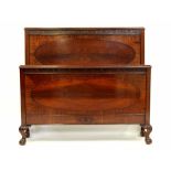 A Victorian mahogany half-tester double bed with Greek Key carved frieze,