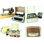 A cased Dansette Viva record player, a similar smaller Alba example, a Jones' sewing machine,