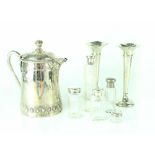 A quantity of mixed silver-plated ware to include a hot water jug decorated with hops,
